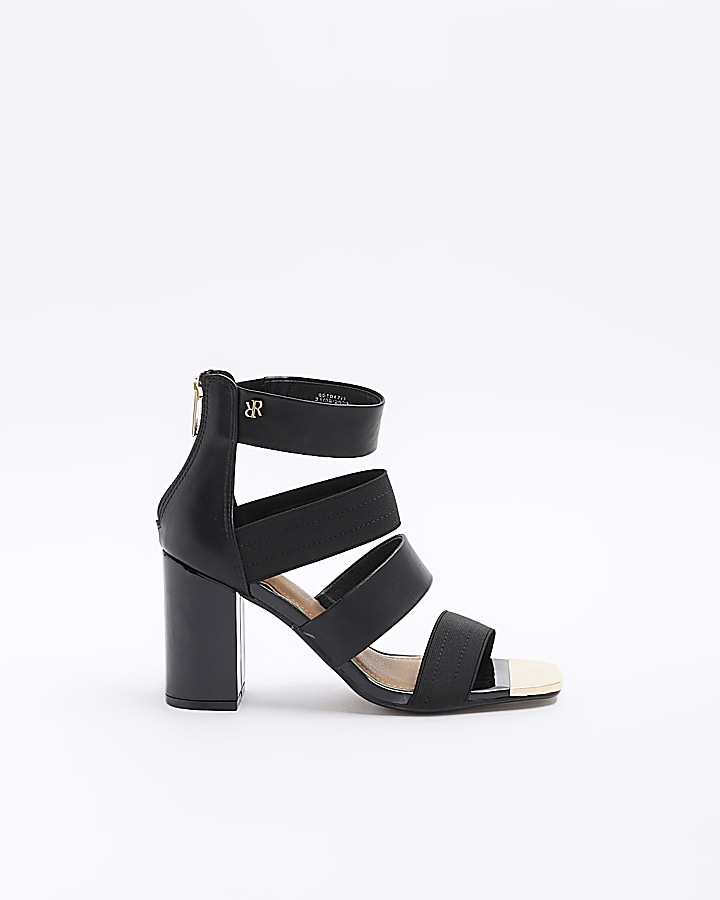 Black strappy heeled shoe boots