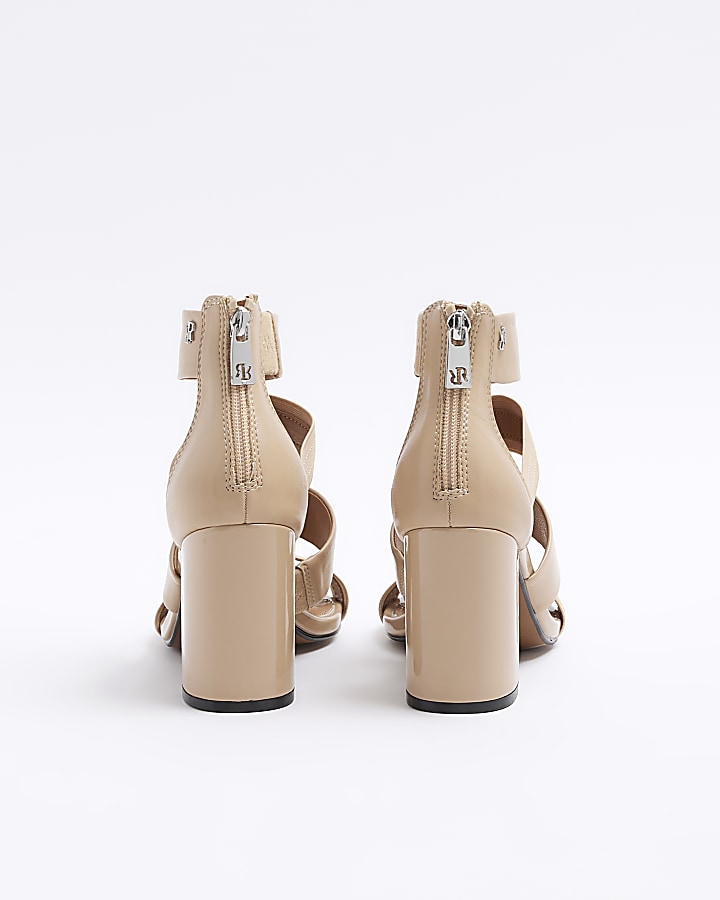 Beige strappy heeled shoe boots