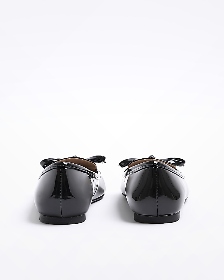 Black bow pointed ballet shoes