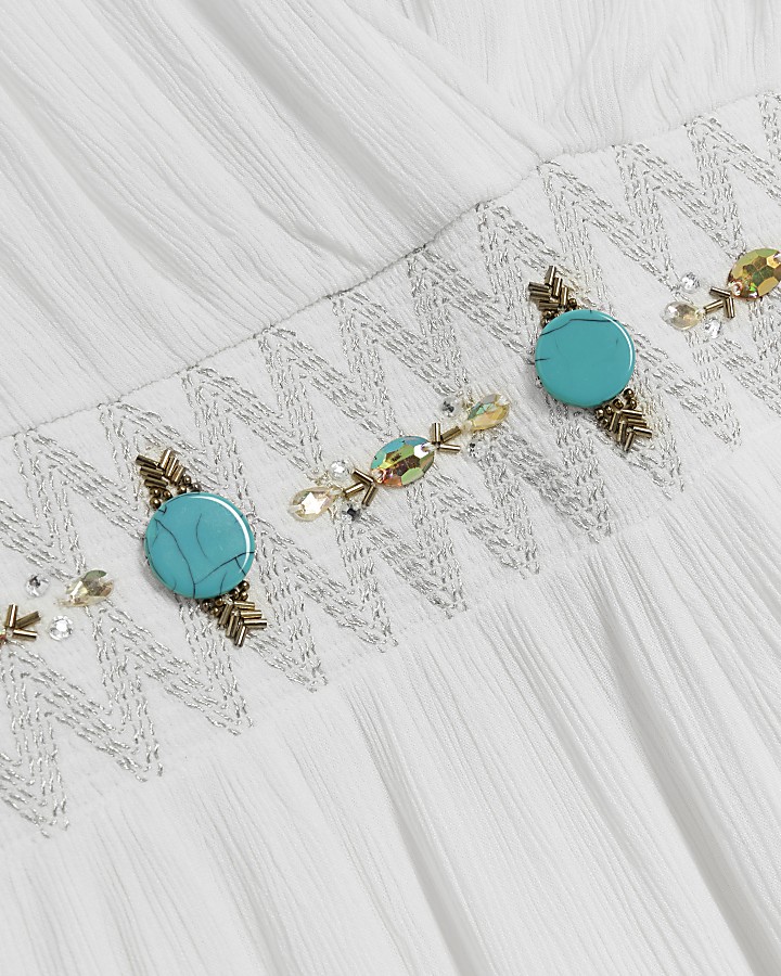 Cream embellished plunge jumpsuit River Island