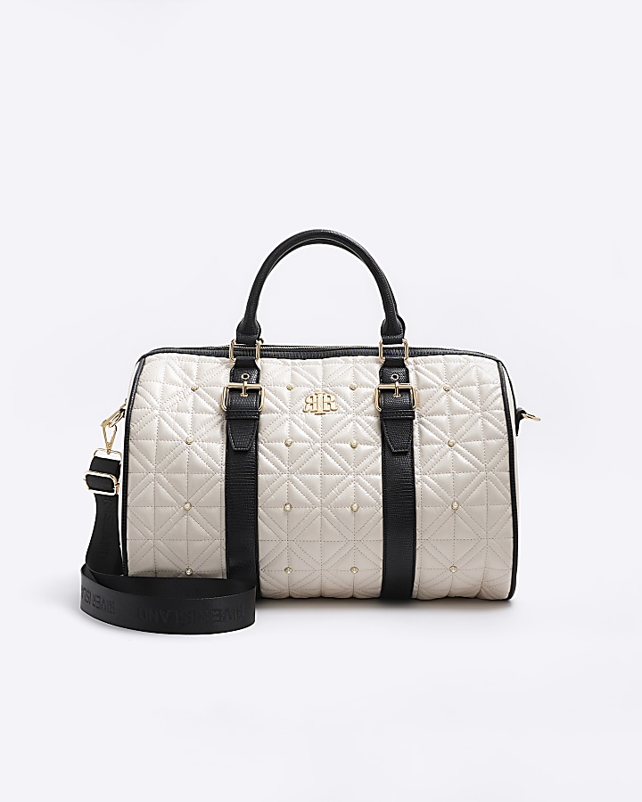 Cream quilted pearl travel bag
