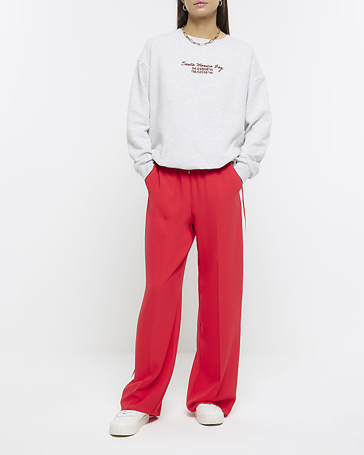 Red side stripe wide leg joggers | River Island