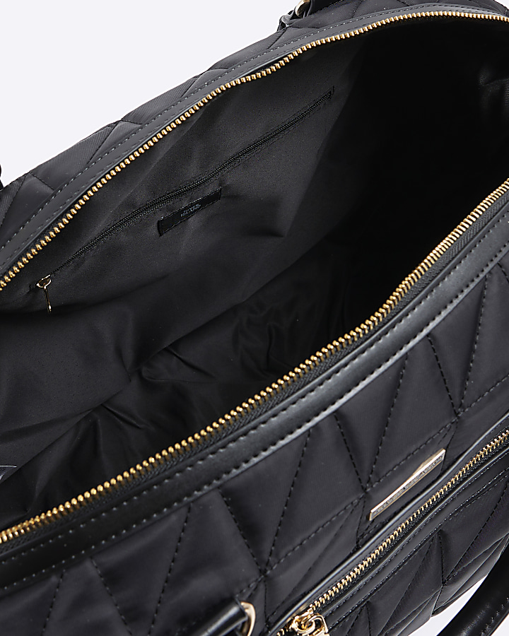 Black quilted zip travel bag