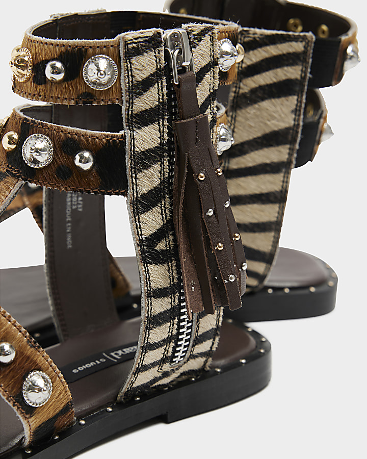 Beige leather studded gladiator sandals