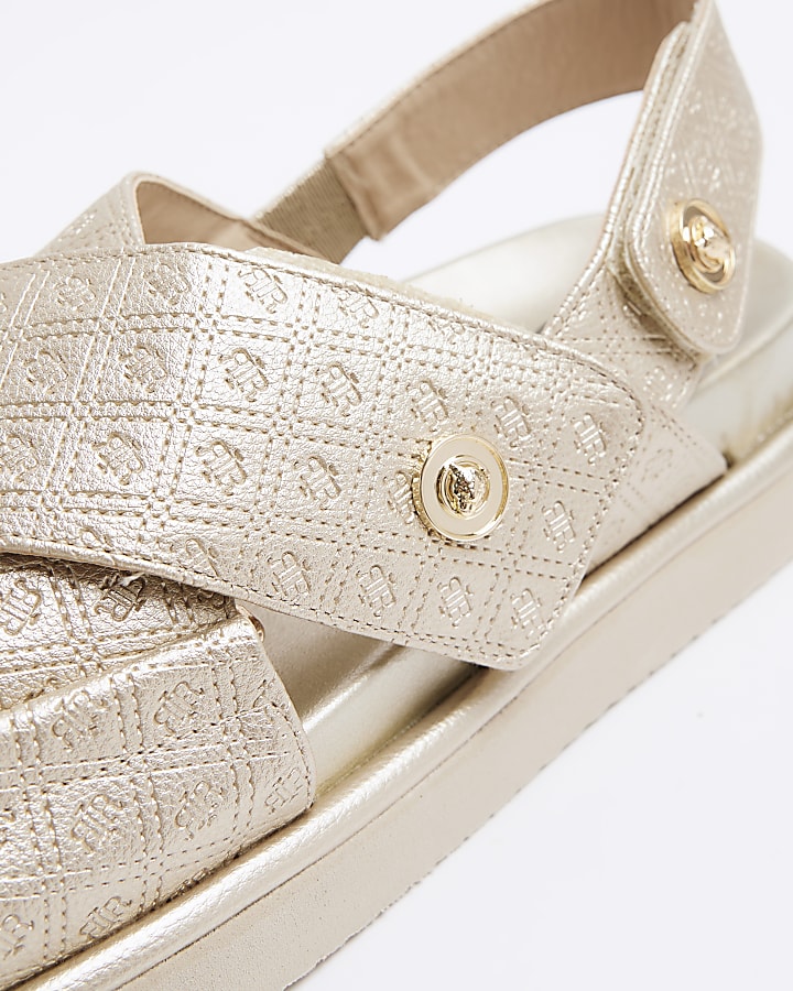 Gold embossed cross strap sandals