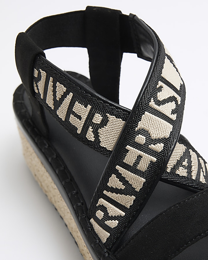 Black crossed strap espadrille sandals