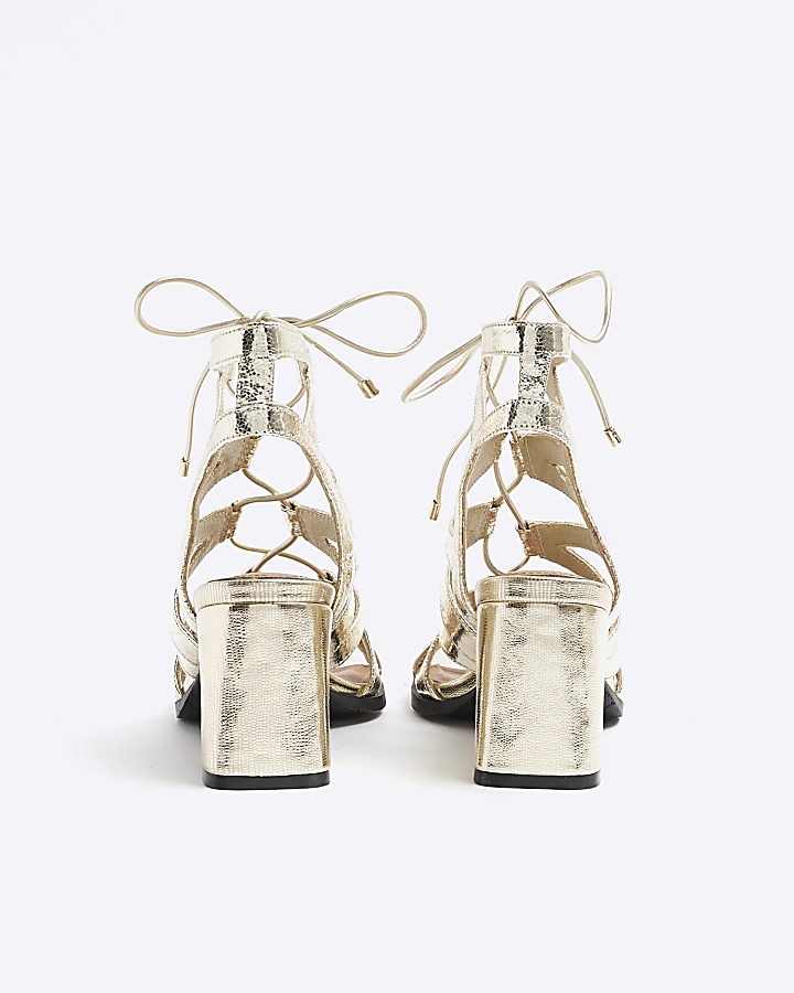 Gold strappy heeled sandals