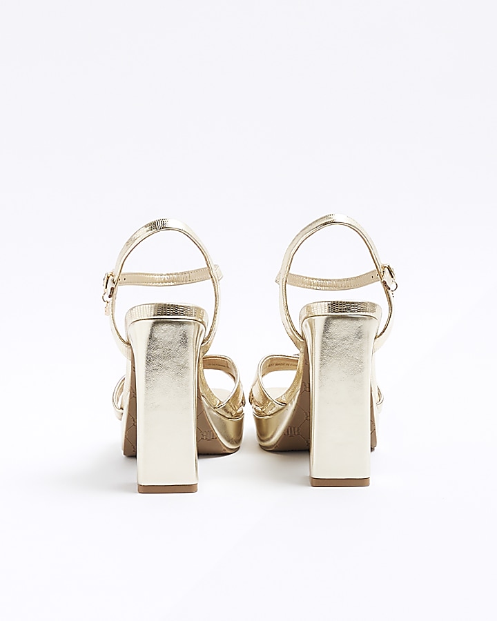 Gold crossed strap heeled sandals