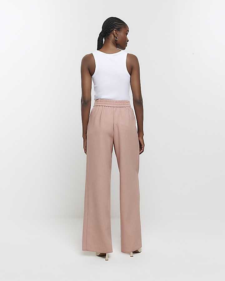 Pink pleated wide leg trousers