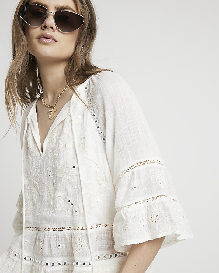Cream embroidered floral blouse