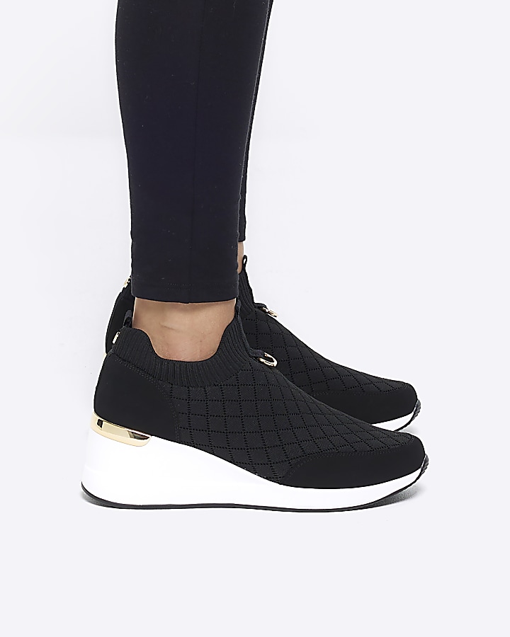 Black wide fit quilted wedge trainers