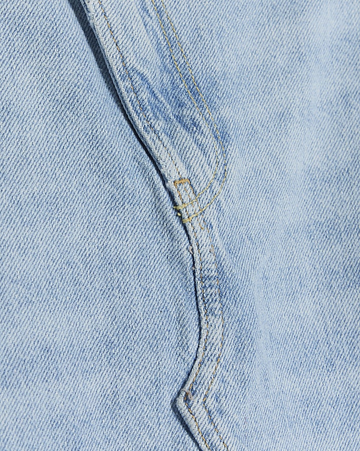 Blue asymmetric distressed denim mini skirt
