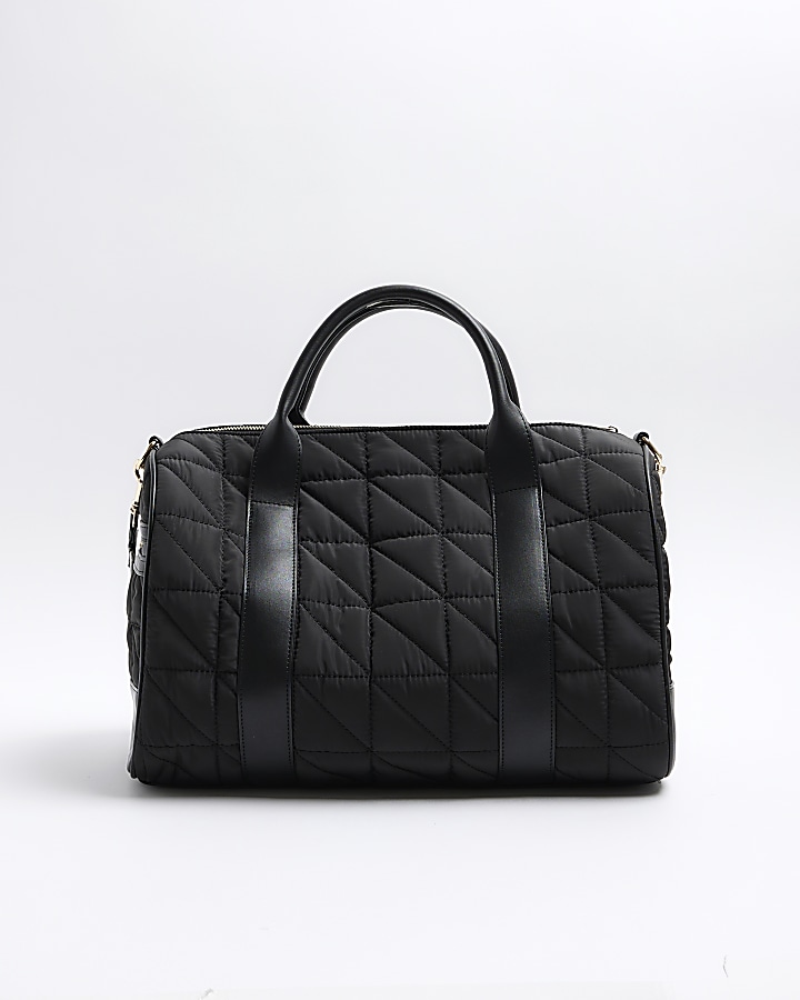Black quilted travel bag River Island