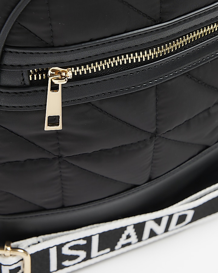 Black quilted travel bag River Island