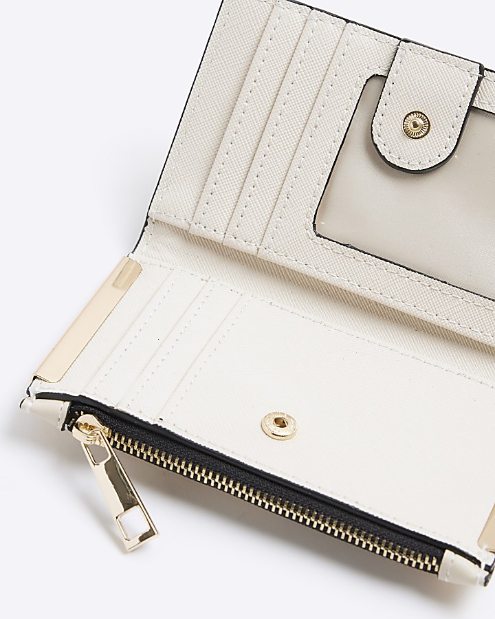 Cream embossed mini purse