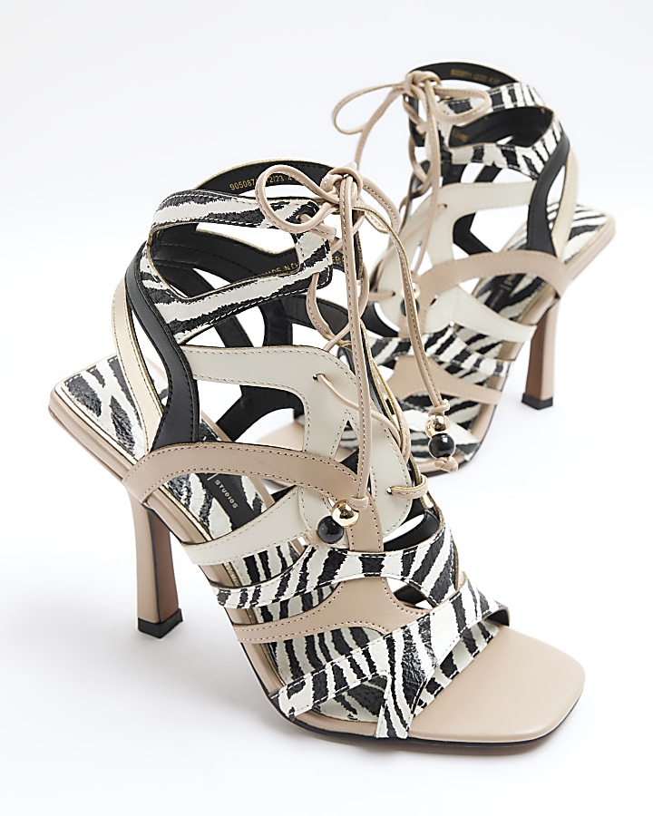 Ecru animal print caged heeled sandals