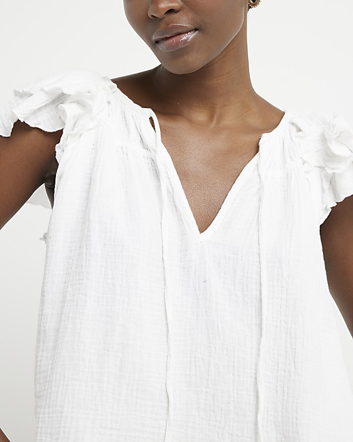 White textured frill sleeve tank top