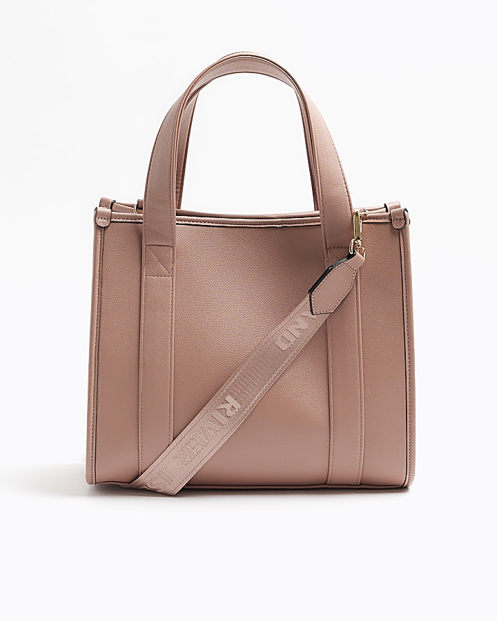 Pink embossed cross body tote bag River Island