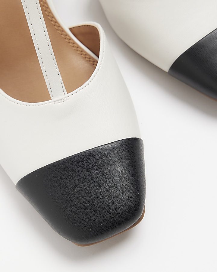 White block heeled court shoes
