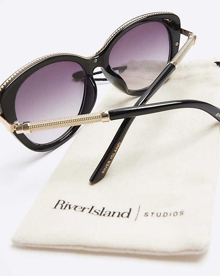 Black trim detail round sunglasses