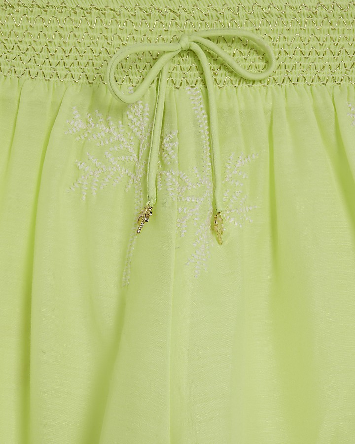 Yellow embroidered beach shorts