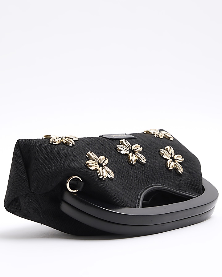 Black floral shell embellished clutch bag