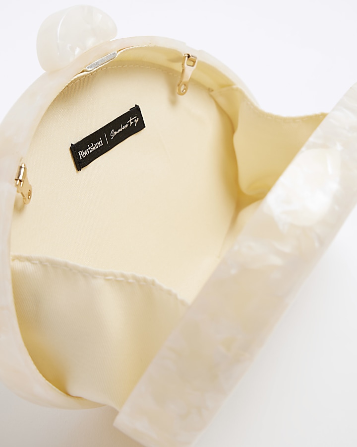 Cream hard shell clutch bag