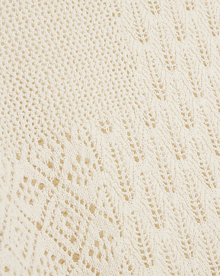 White stitch detail knit top
