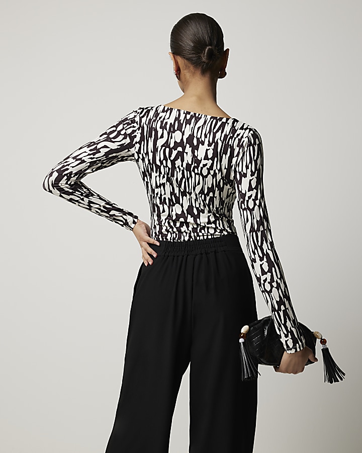 Black abstract long sleeve bodysuit River Island