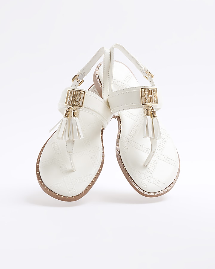 White tassel flat sandals