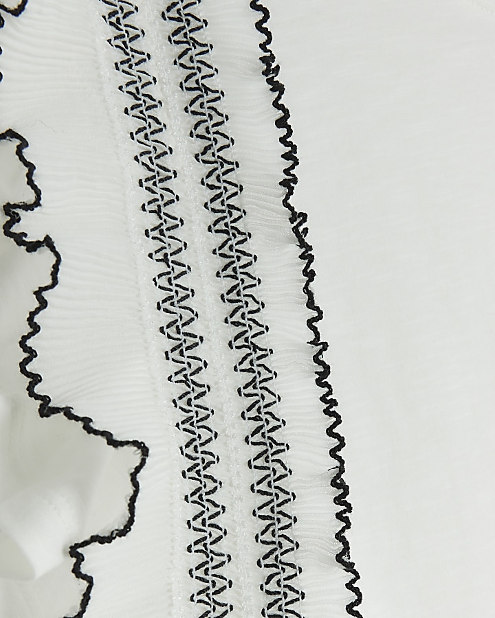 Cream frill stitched top