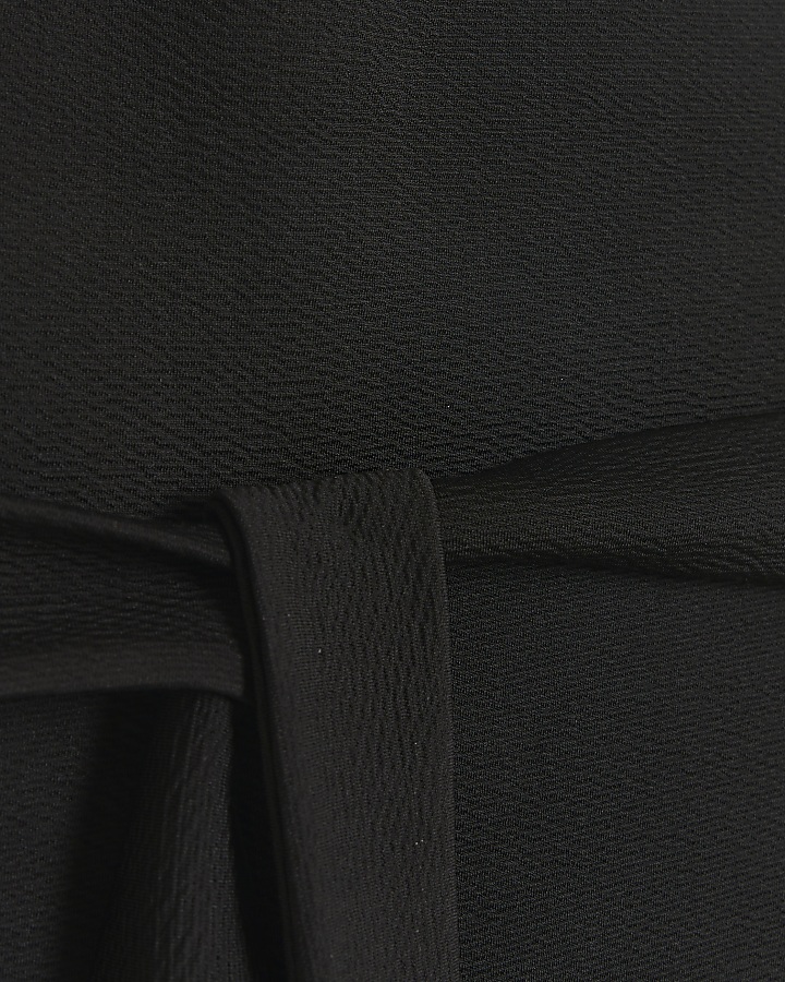 Black belted asymmetric top