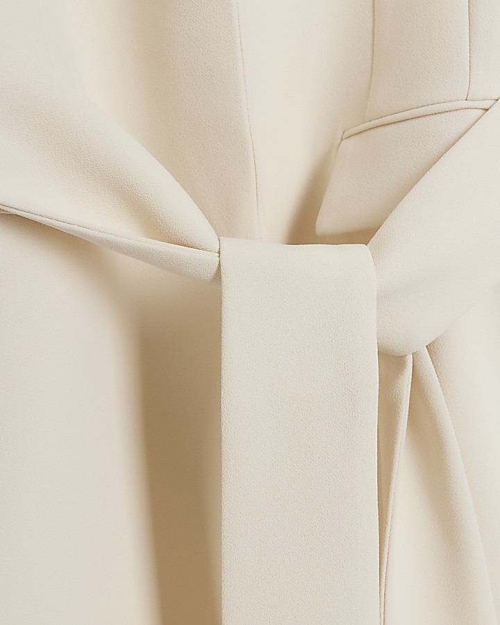 Cream belted wrap blazer