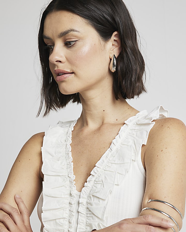 Cream ruffle detail ribbed tank top | River Island