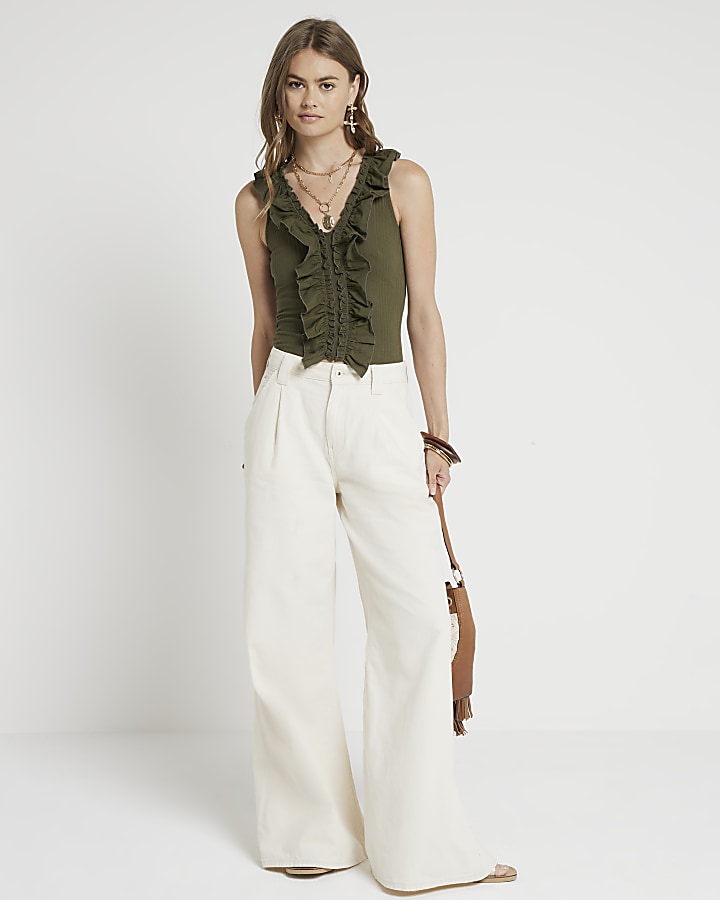 Green ruffle detail ribbed tank top | River Island image.