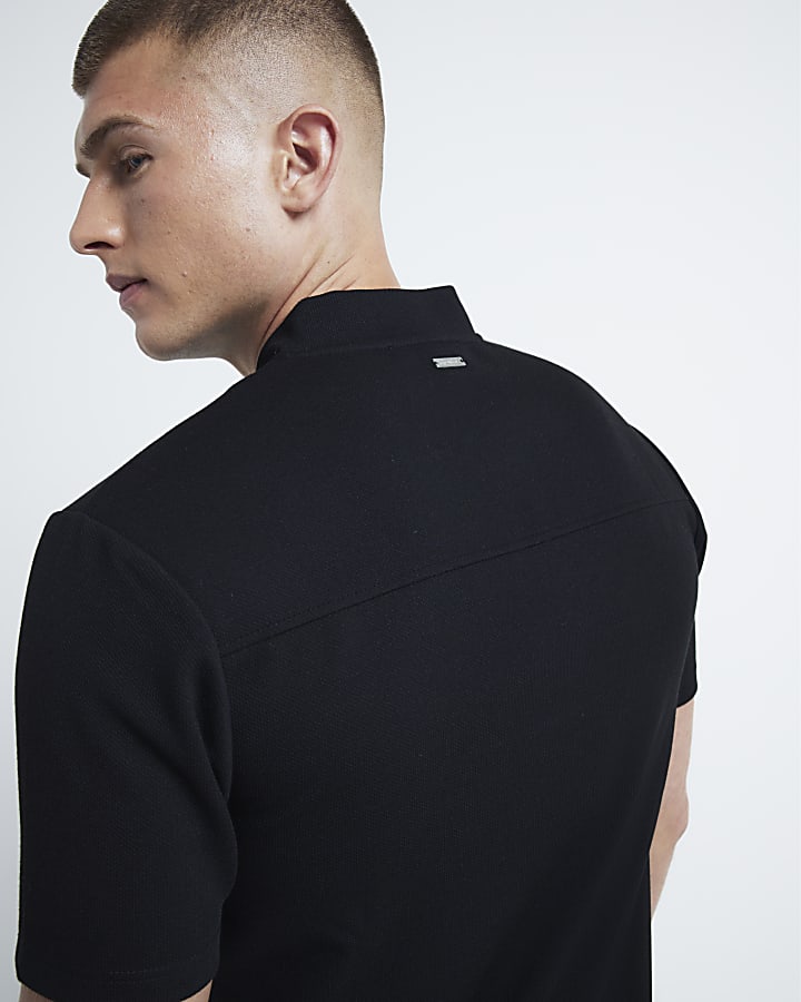 Black slim fit textured half zip polo