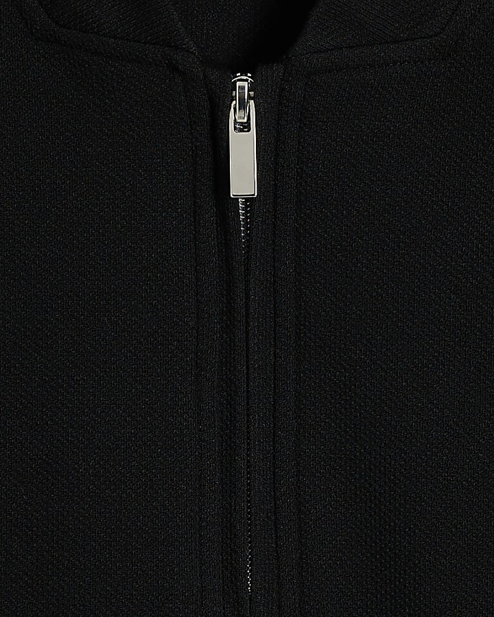 Black slim fit textured half zip polo