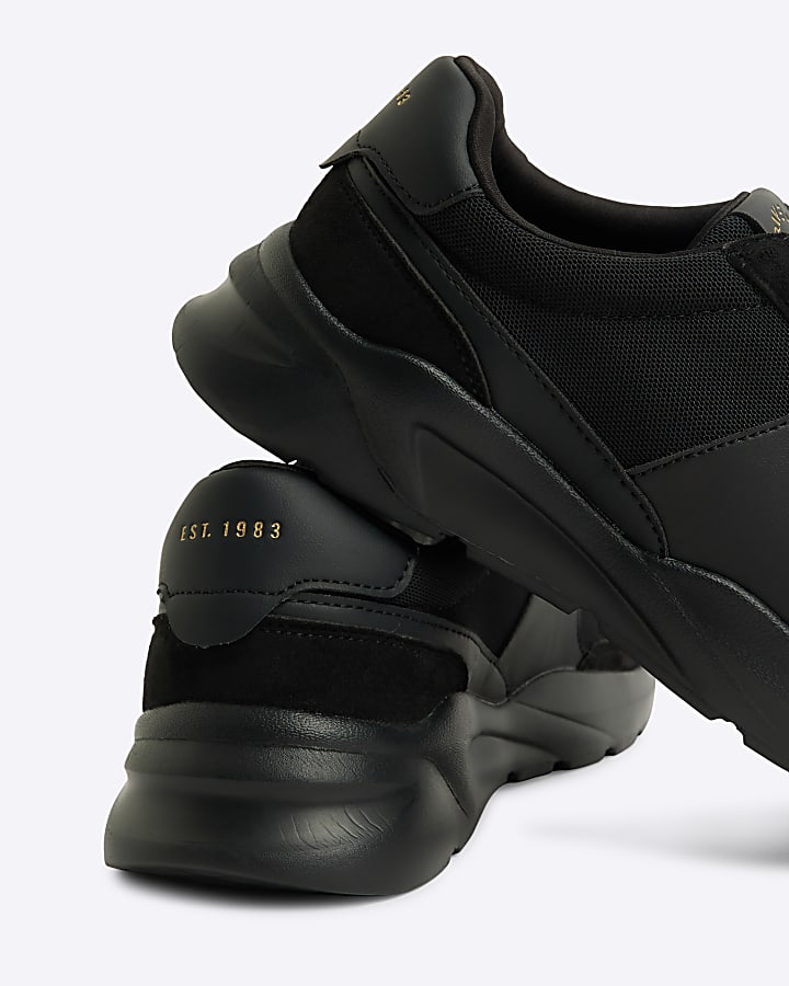Black runner trainers