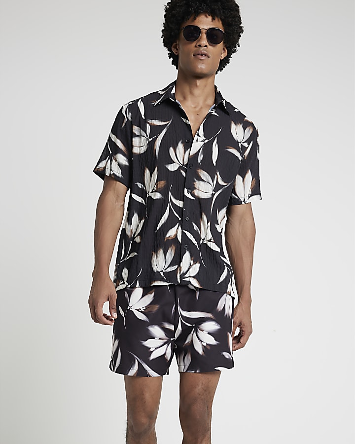 Black regular fit blur floral swim shorts