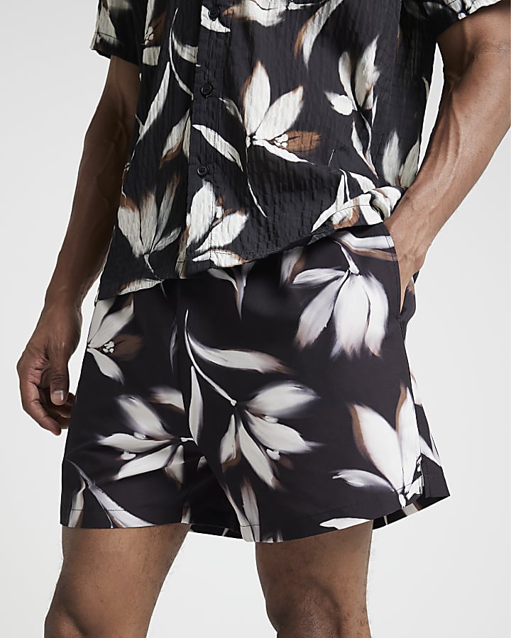 Black regular fit blur floral swim shorts