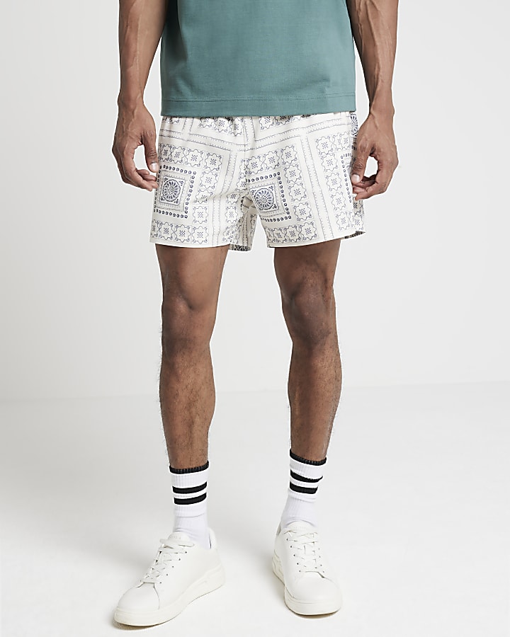 Beige regular fit tile graphic swim shorts