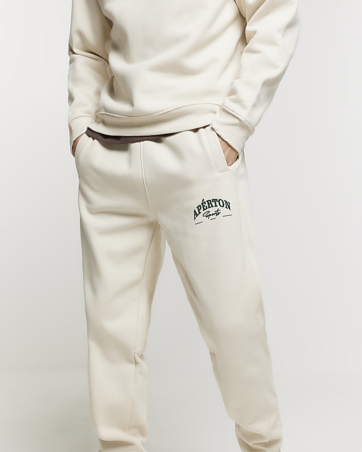 Beige regular fit graphic cuffed joggers