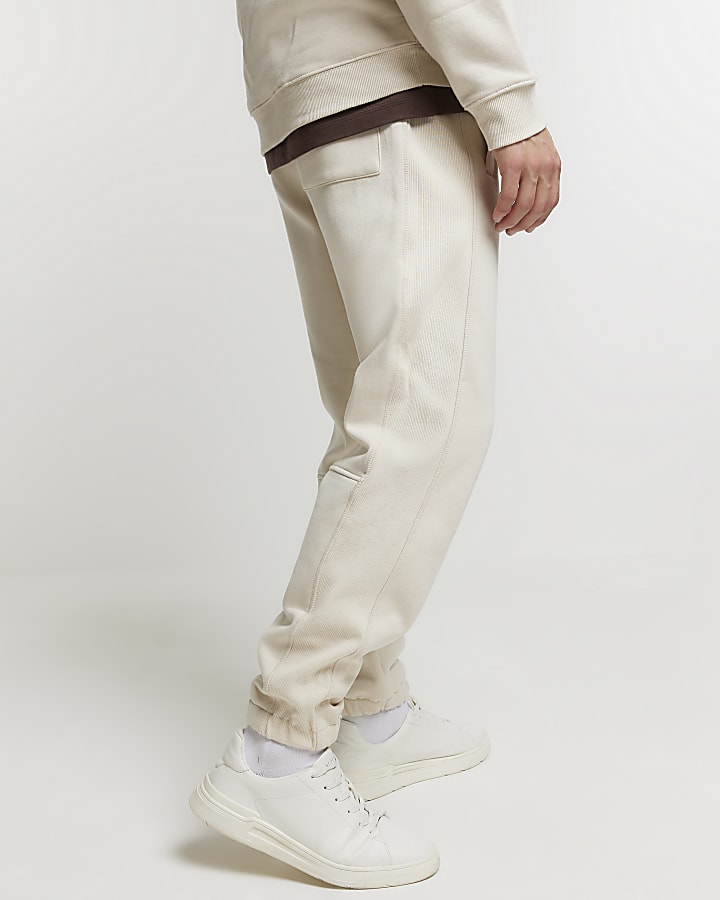 Beige regular fit graphic cuffed joggers