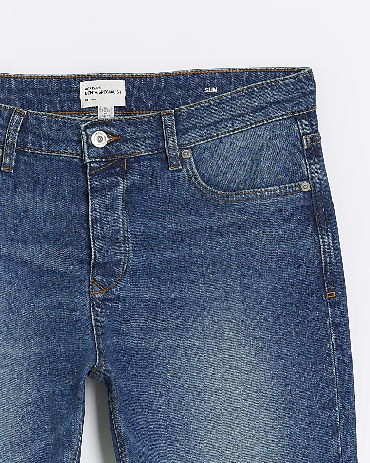 Dark blue slim fit faded jeans