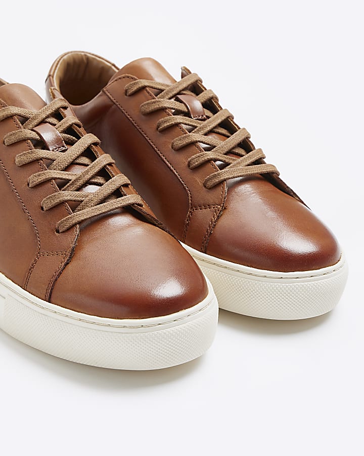 Brown leather lace up trainers