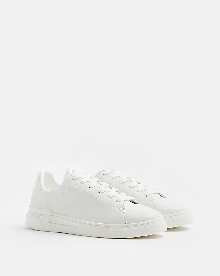 White lace up cupsole trainers