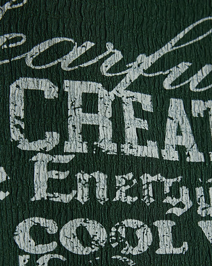 Girls green textured graphic crop top