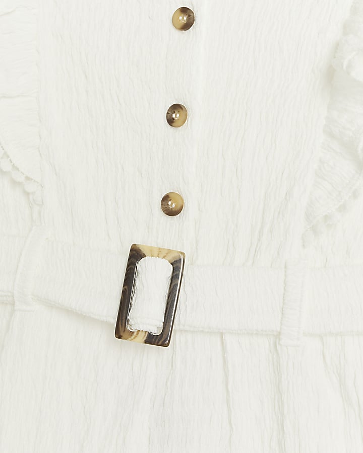 Girls white belted frill playsuit