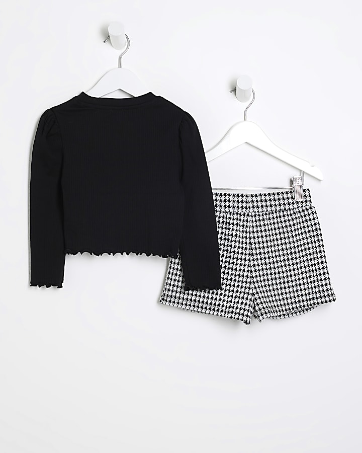 Mini girls black top and dogtooth skort set