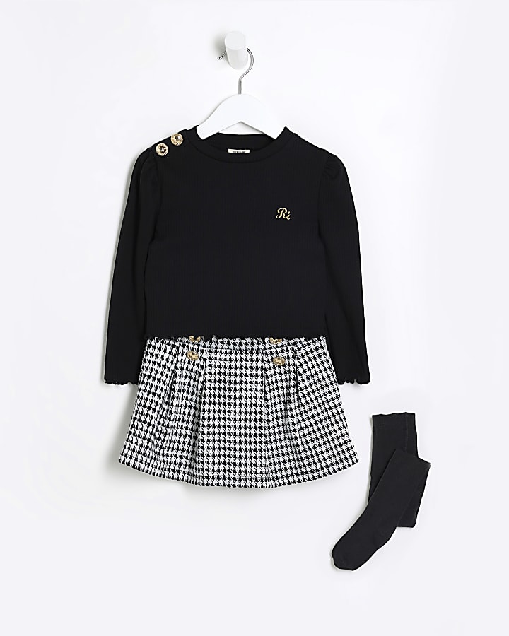 Mini girls black top and dogtooth skort set